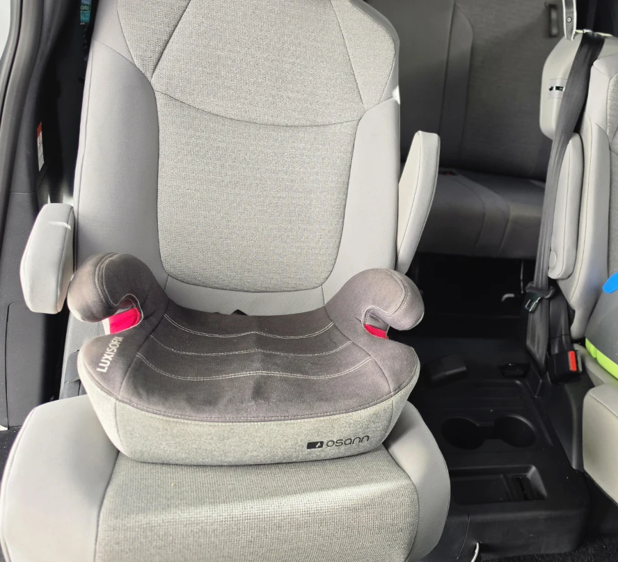 Backless booster seat inside our tour vehicle.