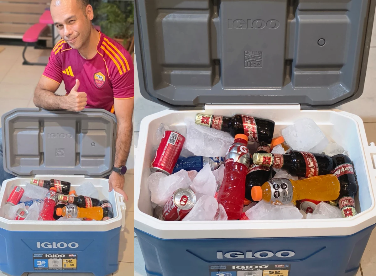 An open cooler filled with ice and drinks.