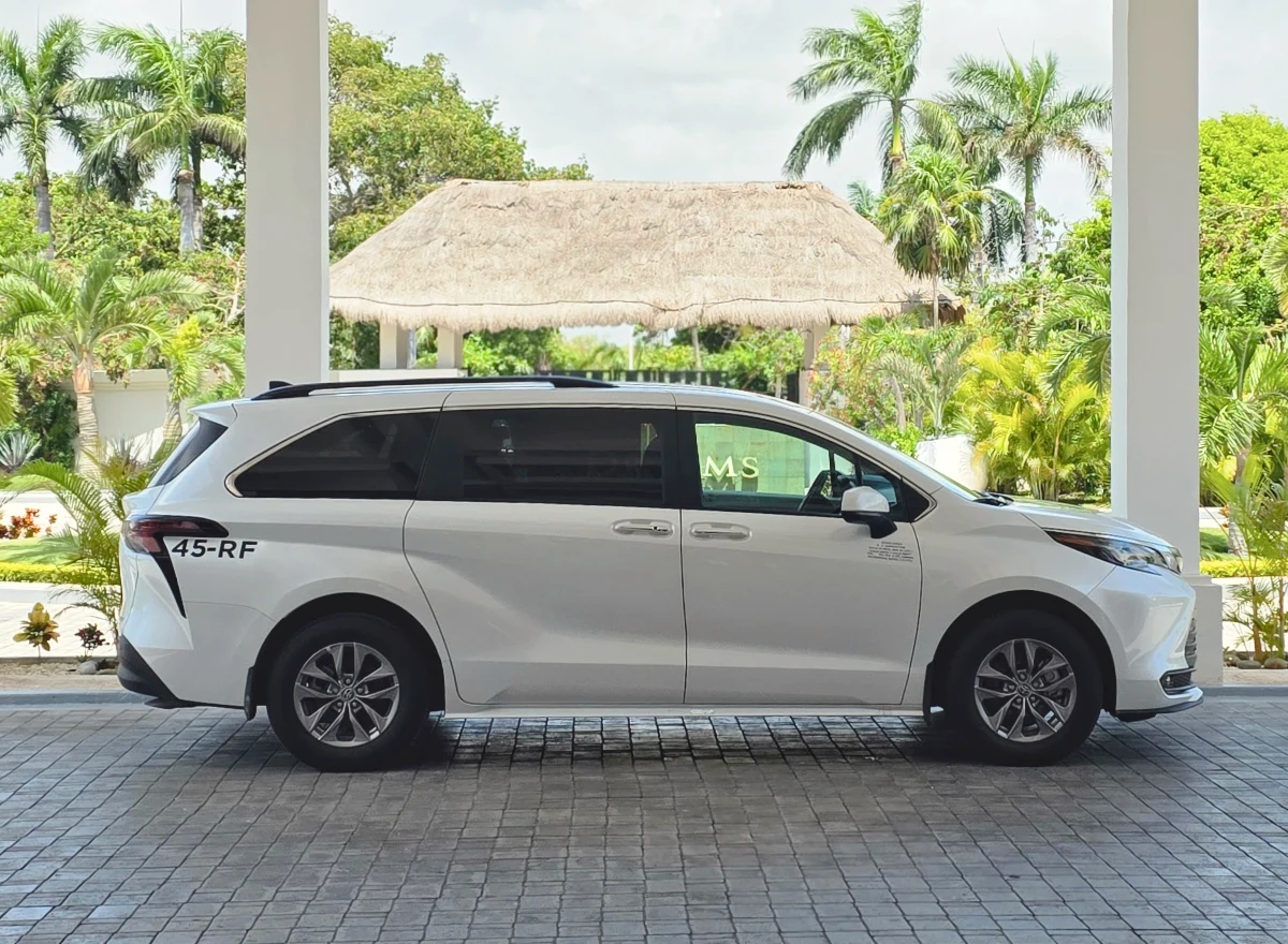White Toyota Sienna for family tours.