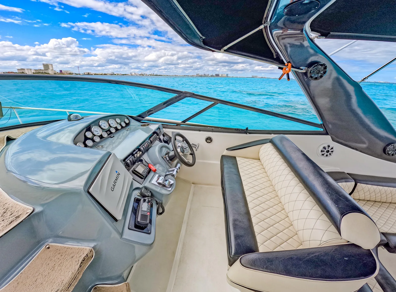 Big Time yacht helm and lounge overlooking the turquoise sea in Cancún