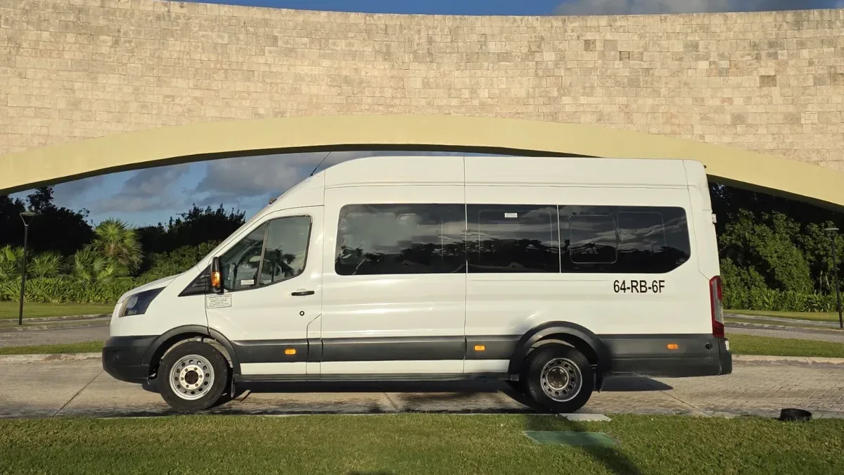 White Ford Transit for group transportation